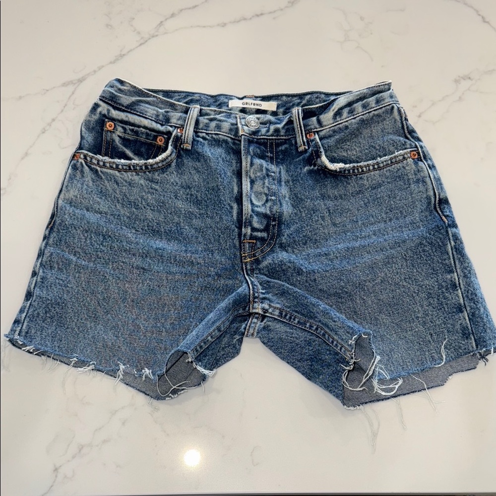 Girlfriend premium denim. Mid rise Jean Shorts with Frayed Hem